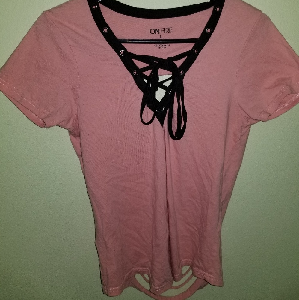 pink shirt with rips